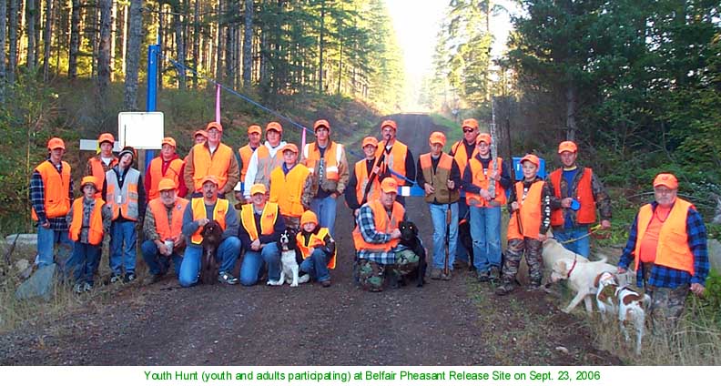 Orange hats & vest provided by Curt Cady (kneeling with brown puppy) to improve safety.